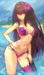  1girl beach bikini bracelet bridal_garter cloud cloudy_sky day dynamitenatalia fate/grand_order fate_(series) flower hair_flower hair_intakes hair_ornament hibiscus highres jewelry long_hair mountain outdoors palm_tree partially_submerged pink_bikini purple_bikini purple_hair red_eyes scathach_(fate) scathach_(swimsuit_assassin)_(fate) sky smile solo swimsuit tree very_long_hair water 