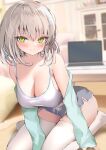  1girl bare_shoulders blurry blurry_background blush breasts camisole cleavage closed_mouth collarbone commentary_request computer depth_of_field green_eyes green_jacket grey_hair grey_shorts hair_between_eyes indoors jacket laptop long_sleeves looking_at_viewer medium_breasts no_shoes off_shoulder open_clothes open_jacket original pon_(ponidrop) short_shorts shorts sleeves_past_wrists smile solo table thighhighs white_camisole white_thighhighs 