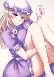  1girl barefoot blonde_hair breasts closed_mouth commentary_request dress hat highres large_breasts long_hair looking_at_viewer maribel_hearn mirufui mob_cap purple_dress purple_eyes short_sleeves simple_background smile solo touhou white_headwear 