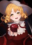  1girl apple blonde_hair breasts dark_background dress drill_hair elly_(touhou) food fruit gradient_background hat highres holding holding_food holding_fruit large_breasts looking_at_viewer majime_joe medium_hair nail_polish open_mouth red_dress red_nails simple_background smile solo teeth touhou touhou_(pc-98) yellow_eyes 