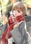  1girl bag blue_eyes blurry blurry_background brown_hair coat grey_coat hair_between_eyes highres lens_flare long_sleeves looking_at_viewer open_mouth original outdoors plaid plaid_scarf railing red_scarf scarf shoulder_bag sleeves_past_wrists smile solo soragane_(banisinngurei) sweater upper_body waving winter yellow_sweater 