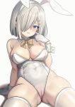  1girl absurdres alternate_costume animal_ears bare_shoulders blue_eyes blush bow bowtie breasts cleavage covered_navel detached_collar fake_animal_ears grey_hair hair_ornament hair_over_one_eye hairclip hamakaze_(kancolle) highleg highleg_leotard highres kantai_collection large_breasts leotard looking_at_viewer neon_p playboy_bunny rabbit_ears rabbit_tail short_hair sitting solo strapless strapless_leotard tail thighhighs traditional_bowtie white_background white_leotard white_thighhighs wrist_cuffs 