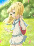  1girl blonde_hair blunt_bangs blush closed_mouth day emapippi falling_petals floating_hair grasslands green_eyes highres lillie_(pokemon) long_hair looking_at_hand petals pink_bag pleated_skirt pokemon pokemon_(game) pokemon_sm ponytail shirt skirt smile white_shirt white_skirt 