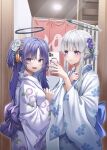  2girls architecture arona&#039;s_sensei_doodle_(blue_archive) blue_archive blue_eyes blush bow breasts east_asian_architecture hair_ornament halo highres holding holding_phone japanese_clothes kimono large_bow long_hair long_sleeves looking_at_viewer multiple_girls noa_(blue_archive) onsen phone purple_eyes purple_hair sensei_(blue_archive) sidelocks smile taking_picture white_hair white_kimono wol_(wol_927) yuuka_(blue_archive) 