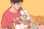  1boy animal animal_ears black_hair brown_eyes cat glasses green_shorts highres holding holding_animal holding_cat ke_(ke_sd) multiple_cats original rabbit_ears red_shirt shirt shorts simple_background sitting t-shirt yellow_background 