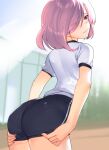  1girl akisa_yositake ass ass_focus ass_grab back black_buruma black_shorts buruma fate/grand_order fate_(series) grabbing_own_ass gym_shirt gym_uniform hair_over_one_eye highres light_purple_hair looking_at_viewer looking_back mash_kyrielight purple_eyes shirt short_hair short_sleeves shorts track_uniform white_shirt 