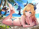  1girl aqua_eyes barefoot bat_tattoo beach beach_towel bikini blonde_hair blue_sky breasts closed_mouth cloud cup day demon_girl demon_horns demon_tail demon_wings drink elbow_rest familiar feet_up full_body highres hololive horns large_breasts long_hair lying makinan mismatched_bikini on_stomach outdoors palm_tree side-tie_bikini_bottom sky smile soles solo swimsuit tail tattoo the_pose toes towel tree wings yuzuki_choco 