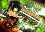  1girl architecture artist_name back bare_shoulders black_hair black_kimono blush breasts bridge closed_mouth commentary_request cup dango day dutch_angle east_asian_architecture expressionless floral_print flower food grass hair_bun hair_flower hair_ornament hair_over_shoulder highres holding holding_cup holding_food japanese_clothes kimono lantern long_hair long_sleeves looking_at_viewer looking_back nature off_shoulder original outdoors paper_lantern red_flower red_sash river rock sanshoku_dango sash sideboob single_hair_bun solo steam straight_hair tanishi_(tanishi_0403) tea teapot tree wagashi wide_sleeves 