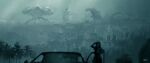  1other blurry blurry_foreground car character_request city cityscape dated giant giant_monster godzilla godzilla_(series) halil_ural highres kaijuu looking_afar monster mothra motor_vehicle palm_tree reflection scenery signature tree urban windshield 