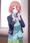  1girl blue_eyes blue_jacket blue_sweater blurry blurry_background blush brown_hair closed_mouth commentary cowboy_shot eyelashes eyes_visible_through_hair facing_viewer go-toubun_no_hanayome green_skirt hair_between_eyes head_tilt headphones headphones_around_neck highres holding holding_headphones indoors jacket long_hair looking_at_viewer manjirou_(manji_illust) nakano_miku open_clothes open_jacket pleated_skirt sidelocks skirt smile solo standing sweater 