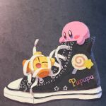  black_background blue_eyes blush_stickers closed_mouth converse highres invincible_candy kirby kirby_(series) miclot miniature no_humans open_mouth orange_footwear patch shoelaces shoes sneakers star_(symbol) 