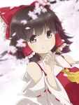  1girl :t bow brown_eyes brown_hair cherry_blossoms closed_mouth commentary detached_sleeves hair_bow hair_tubes hakurei_reimu highres holding_manga looking_at_viewer medium_hair red_bow ribbon-trimmed_sleeves ribbon_trim sidelocks smile solo touhou tyouseki upper_body 