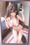  1girl absurdres animal_ear_fluff animal_ears arknights bed bikini black_hair breasts brown_eyes cellphone cleavage feet_out_of_frame hair_between_eyes highres iphone large_breasts long_hair looking_at_viewer mirror phone selfie side-tie_bikini_bottom smartphone solo svo23 swimsuit tail taking_picture texas_(arknights) wolf_ears wolf_girl wolf_tail 
