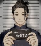  1boy barbie_mugshot_(meme) black_eyes black_hair character_name closed_mouth commentary_request earrings getou_suguru hair_bun holding holding_sign jewelry jujutsu_kaisen looking_at_viewer male_focus meme mugshot nori20170709 sign solo twitter_username 