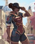  1girl blue_eyes building dark-skinned_female dark_skin day elaimart english_commentary hand_on_headwear hat highres looking_at_viewer mechanical_arms nail_polish official_alternate_costume open_hand outdoors overwatch overwatch_2 prosthesis short_shorts shorts smile sojourn_(overwatch) solo standing upper_body yellow_nails 