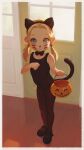  1girl :p alkemanubis animal_ears black_footwear black_leotard black_pantyhose blonde_hair blue_eyes bow bowtie cat_ears cat_tail drawn_whiskers fake_animal_ears fake_tail full_body halloween highres indoors leotard long_hair looking_at_viewer original pantyhose pumpkin shoes smile solo tail tongue tongue_out twintails 