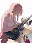  1girl absurdres amplifier barefoot blue_eyes bocchi_the_rock! closed_mouth clothes_writing commentary_request cube_hair_ornament dated electric_guitar gotou_hitori guitar hair_ornament highres holding instrument long_hair long_sleeves looking_down one_side_up pink_hair pink_shirt shirt sidelocks signature simple_background sitting solo waterkuma white_background 