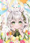  1girl absurdres animal_ears arm_support blurry braid commentary_request crown_braid depth_of_field detached_sleeves easter fake_animal_ears field flower flower_field foot_up genshin_impact gradient_hair green_eyes hair_between_eyes hair_ornament head_rest highres leaf_hair_ornament long_hair looking_at_viewer lying mayu_(sh-n-9) multicolored_hair nahida_(genshin_impact) on_stomach outdoors pointy_ears rabbit rabbit_ears short_sleeves side_ponytail sidelocks single_braid smile soles stirrup_legwear streaked_hair symbol-shaped_pupils toeless_legwear toes white_hair 