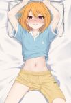  1girl absurdres arms_up bed_sheet blue_shirt blush breasts brown_eyes collarbone from_above hair_between_eyes highres holding holding_pillow idolmaster idolmaster_cinderella_girls idolmaster_cinderella_girls_starlight_stage lips long_hair looking_at_viewer lpb lying midriff_peek navel on_back on_bed orange_hair pillow shirt short_sleeves shorts small_breasts solo yellow_shorts yuuki_haru 