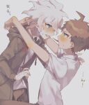  2boys :d ahoge arms_up blush brown_hair brown_pants danganronpa_(series) danganronpa_2:_goodbye_despair food food_in_mouth from_side green_jacket grey_background grey_shirt hinata_hajime hood hood_down hooded_jacket imminent_kiss jacket komaeda_nagito long_sleeves multiple_boys oh_0409 pants pocky pocky_in_mouth print_shirt shirt short_hair short_sleeves simple_background sitting smile sweat translation_request yaoi 