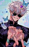  1boy animal bandaid bandaid_on_face bandaid_on_hand bandaid_on_nose black_jacket blue_background blue_eyes bug butterfly cellphone flip_phone gojou_satoru grin hair_ornament hairclip hands_up jacket jewelry ju_angbal_love jujutsu_kaisen jujutsu_tech_uniform looking_at_viewer male_focus open_mouth phone ring round_eyewear school_uniform short_hair smile solo sticker_on_face sunglasses teeth upper_body white_hair 