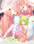  1girl bed bow braid closed_mouth curtains double_bun frills full_body green_eyes green_hair hair_bow hair_bun hair_ornament heart highres holding holding_stuffed_toy indoors kanase_(mcbrwn18) long_sleeves looking_at_viewer medium_hair morinaka_kazaki nijisanji no_shoes object_hug on_bed pillow pink_bow pink_shorts pink_thighhighs polka_dot polka_dot_bow shirt shorts sitting smile solo star_(symbol) striped striped_thighhighs stuffed_animal stuffed_toy teddy_bear thighhighs transparent transparent_curtains white_shirt white_thighhighs 