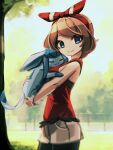  1girl black_shorts blue_eyes bow bracelet brown_hair from_side glaceon hair_bow holding holding_pokemon jewelry looking_at_viewer makaroll may_(pokemon) outdoors pokemon pokemon_(creature) pokemon_(game) pokemon_oras red_shirt shirt shorts shorts_under_shorts sleeveless sleeveless_shirt smile tree white_shorts 