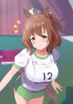  1girl animal_ears aston_machan_(umamusume) brown_hair buruma crown green_buruma green_eyes highres horse_ears horse_girl looking_at_viewer mini_crown original_race_uniform_(umamusume) race_bib shirt smile solo t-shirt umamusume white_shirt yukke_jan 