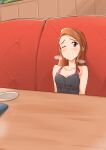  1girl absurdres black_tank_top blush brown_hair cafe couch highres idolmaster idolmaster_million_live! implied_cunnilingus minase_iori multicolored_clothes on_couch one_eye_closed pink_tank_top red_eyes solo table tank_top twogie 