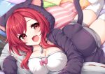  1girl :d absurdres animal_ear_hood azur_lane breasts cat_girl cat_tail cleavage fang highres hood hoodie i-19_(azur_lane) i-19_(pillowy_paradise)_(azur_lane) kinomiki_nobori large_breasts long_hair lying on_stomach open_clothes open_hoodie open_mouth oppai_loli pendant_choker pillow red_eyes red_hair shorts skin_fang sleeves_past_wrists smile solo tail thighhighs white_thighhighs 