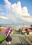  1girl alternate_costume arms_behind_back black_skirt black_socks blue_sky bow cloud day feet_out_of_frame hair_bow highres house ichikawa_feesu kamikaze_(kancolle) kantai_collection leaning_forward long_hair looking_at_viewer looking_back mountainous_horizon ocean outdoors purple_eyes purple_hair red_shirt road scenery shirt skirt sky sleeveless sleeveless_shirt socks solo yellow_bow 