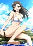  1girl asymmetrical_bangs barefoot bikini black_hair blue_sky breasts brown_eyes cloud cloudy_sky day feet foot_out_of_frame girls_und_panzer halterneck highres horizon inflatable_raft knee_up legs long_hair looking_at_viewer medium_breasts nishi_kinuyo ocean omachi_(slabco) one_eye_closed open_mouth outdoors sitting sky smile soles solo straight_hair string_bikini swimsuit toes white_bikini 