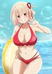  1girl bikini blonde_hair blush breasts cleavage collarbone cowboy_shot dars_(recolors) grin hair_ribbon hand_up highres holding holding_innertube innertube large_breasts looking_at_viewer lycoris_recoil navel nishikigi_chisato one_side_up open_hand red_bikini red_eyes ribbon short_hair smile solo stomach swimsuit teeth water 