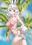  1girl animal_ears arctic_hare_(kemono_friends) asymmetrical_one-piece_swimsuit bare_shoulders blurry blurry_background breasts casual_one-piece_swimsuit commentary cowboy_shot gradient_swimsuit hair_ornament heart heart_hair_ornament highres kemono_friends kemono_friends_3 large_breasts midriff official_alternate_costume one-piece_swimsuit palm_tree pink_one-piece_swimsuit rabbit_ears rabbit_girl rabbit_tail red_eyes scrunchie short_hair sidelocks single-shoulder_one-piece_swimsuit single_strap solo swimsuit tail tanabe_(fueisei) tree twisted_torso two-tone_one-piece_swimsuit white_hair wrist_scrunchie 