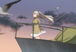  1girl annin_musou bird brown_coat brown_eyes cannon cloud coat conte_di_cavour_(kancolle) dawn dress feet_out_of_frame gradient_sky grey_hair hands_in_pockets kantai_collection long_hair long_sleeves railing seagull sky two_side_up white_dress 