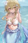  1girl blonde_hair blush breasts choker commentary_request feather_hair_ornament feathers flower genshin_impact hair_between_eyes hair_flower hair_ornament highres looking_at_viewer lumine_(genshin_impact) medium_breasts mermaid monster_girl navel ocean raiya_atelier short_hair_with_long_locks sitting smile solo wet white_flower yellow_eyes 