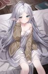  1girl bare_shoulders between_legs blush book brown_sweater collarbone elf frieren green_eyes grey_hair hand_between_legs highres indoors long_hair long_sleeves looking_at_viewer messy_hair nightgown on_bed parted_lips pointy_ears rubbing_eyes shouu-kun sidelocks sitting sleeves_past_wrists solo sousou_no_frieren strap_slip sweater thick_eyebrows very_long_hair white_nightgown 