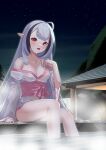  1girl absurdres ahoge azur_lane bare_shoulders black_hair blunt_bangs breasts collarbone fang highres japanese_clothes kimono light_blush long_hair looking_at_viewer ma_ri_dai_ku multicolored_hair night night_sky official_alternate_costume onsen open_mouth outdoors pink_sash pointy_ears red_eyes rock sash sevastopol_(azur_lane) sevastopol_(more_than_a_little_drunk)_(azur_lane) skin_fang sky small_breasts solo steam streaked_hair tree water white_hair white_kimono 
