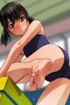  1girl absurdres barefoot black_hair blue_one-piece_swimsuit blurry blurry_background blush brown_eyes climbing commentary_request from_below highres indoors leg_up looking_at_viewer low_twintails matsunaga_kouyou one-piece_swimsuit original paid_reward_available school_swimsuit short_hair smile soles solo swimsuit toes twintails wet wet_hair window 