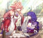  2girls :d animal_ears bare_shoulders book breasts cleavage commentary_request detached_sleeves fox_ears genshin_impact hand_up highres holding holding_book japanese_clothes kimono korean_commentary large_breasts long_hair long_sleeves looking_at_another multiple_girls off_shoulder omegiricecake open_mouth pink_hair purple_eyes purple_hair purple_kimono raiden_shogun red_skirt shirt skirt sleeveless sleeveless_shirt smile very_long_hair white_shirt wide_sleeves yae_miko 