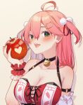  1girl ahoge apple bell black_choker blush breasts brown_background cat_hair_ornament choker cleavage collarbone food frilled_wristband fruit hair_ornament hairclip heart highres holding holding_food holding_fruit hololive large_breasts looking_at_viewer magowasabi medium_hair neck_bell open_mouth pink_hair pom_pom_(clothes) red_wristband sakura_miko simple_background solo two_side_up virtual_youtuber wristband 