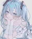  1girl 39 aqua_eyes aqua_hair blush dress hatsune_miku head_rest head_tilt highres jewelry kagaku_o long_hair looking_at_viewer lying miku_day off-shoulder_dress off_shoulder on_stomach ring short_sleeves solo twintails vocaloid white_background white_dress 