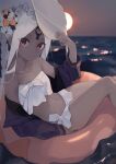  1girl abigail_williams_(fate) abigail_williams_(swimsuit_foreigner)_(fate) absurdres arm_up bikini blurry blurry_background closed_mouth collarbone commentary dark-skinned_female dark_skin depth_of_field fate/grand_order fate_(series) feet_out_of_frame hand_on_headwear highres horizon innertube jacket long_hair long_sleeves looking_at_viewer ocean off_shoulder open_clothes open_jacket paopaojiu puffy_long_sleeves puffy_sleeves purple_jacket red_eyes solo strapless strapless_bikini sun sunset swimsuit symbol-only_commentary water white_bikini white_hair white_headwear 