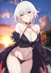  1girl absurdres ahoge alternate_hairstyle beach bikini black_bikini black_jacket blush breasts cleavage cloud commentary_request curio_(curiofinity) fate/grand_order fate_(series) hair_between_eyes highres jacket jeanne_d&#039;arc_alter_(fate) jeanne_d&#039;arc_alter_(swimsuit_berserker)_(fate) large_breasts looking_at_viewer navel o-ring o-ring_bikini off_shoulder outdoors short_hair sky solo stomach sunset swimsuit thighs water white_hair yellow_eyes 