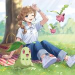  1girl ;d absurdres arm_up blanket blue_eyes blurry blurry_background character_print checkered_blanket chikorita denim flower flying grass hair_ornament hairclip highres hoppip jeans light_brown_hair light_rays long_hair merchandise morikura_en multi-tied_hair official_art one_eye_closed outdoors pants picnic picnic_basket pokemon pokemon_(creature) polo_shirt ponytail shading_eyes shirt shoes short_sleeves sitting sky smile sneakers tree watch white_footwear white_shirt wristwatch 