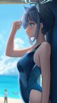  1girl absurdres animal_ear_fluff animal_ears beach black_one-piece_swimsuit blue_archive blue_eyes blue_halo blue_one-piece_swimsuit blue_sky blurry blurry_background blush breasts cloud competition_swimsuit cowboy_shot cross cross_hair_ornament day extra_ears from_side grey_hair hair_ornament halo highleg highleg_swimsuit highres inverted_cross may9 medium_breasts ocean official_alternate_costume one-piece_swimsuit outdoors shiroko_(blue_archive) shiroko_(swimsuit)_(blue_archive) sidelocks sky smile solo_focus standing swimsuit two-tone_swimsuit wolf_ears 
