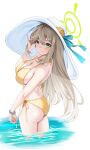  1girl adjusting_hair ass bikini blonde_hair blue_archive blush bracelet breasts closed_mouth flower green_eyes halo hat hat_flower highres jewelry large_breasts long_hair looking_at_viewer matrix16 nonomi_(blue_archive) nonomi_(swimsuit)_(blue_archive) smile solo strap_gap sun_hat swimsuit very_long_hair wading yellow_bikini 