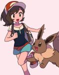  1girl :d brown_hair commentary_request eevee elaine_(pokemon) eyelashes green_shorts happy hat highres leg_up long_hair open_mouth outstretched_arm pokemon pokemon_(creature) pokemon_(game) pokemon_lgpe ponytail red_headwear shirt shoes short_sleeves shorts smile tyako_089 