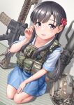  1girl absurdres assault_rifle barefoot black_hair blue_skirt camouflage camouflage_headwear carl_gustaf_recoilless_rifle chest_rig flower grey_eyes gun hair_flower hair_ornament headwear_removed helmet helmet_removed highres idolmaster idolmaster_cinderella_girls kobayakawa_sae long_hair recoilless_rifle red_flower rifle school_uniform serafuku shirt skirt smile solo waruzamurai weapon white_shirt woodland_camouflage 