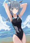  1girl absurdres animal_ear_fluff animal_ears arms_behind_head beach black_one-piece_swimsuit blue_archive blue_eyes blue_sky breasts cloud commentary competition_swimsuit covered_navel cross_hair_ornament day extra_ears grey_hair hair_ornament halo highres horizon low_ponytail medium_breasts medium_hair mismatched_pupils multicolored_clothes multicolored_swimsuit ocean one-piece_swimsuit outdoors ref_(pmxt4483) shiroko_(blue_archive) shiroko_(swimsuit)_(blue_archive) sky solo swimsuit wolf_ears 